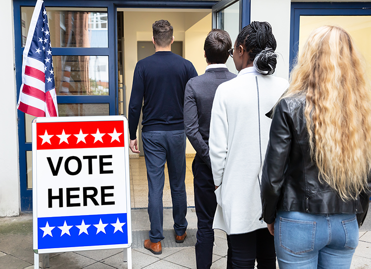 Photo of people waiting in line to vote